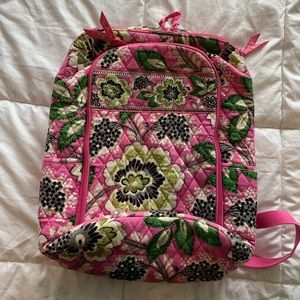 Pink Vera Bradley backpack with several pockets